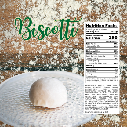Single vanilla biscotti cookie coated in white icing on a clear plate with flour scattered on a wooden surface and nutrition label displayed.